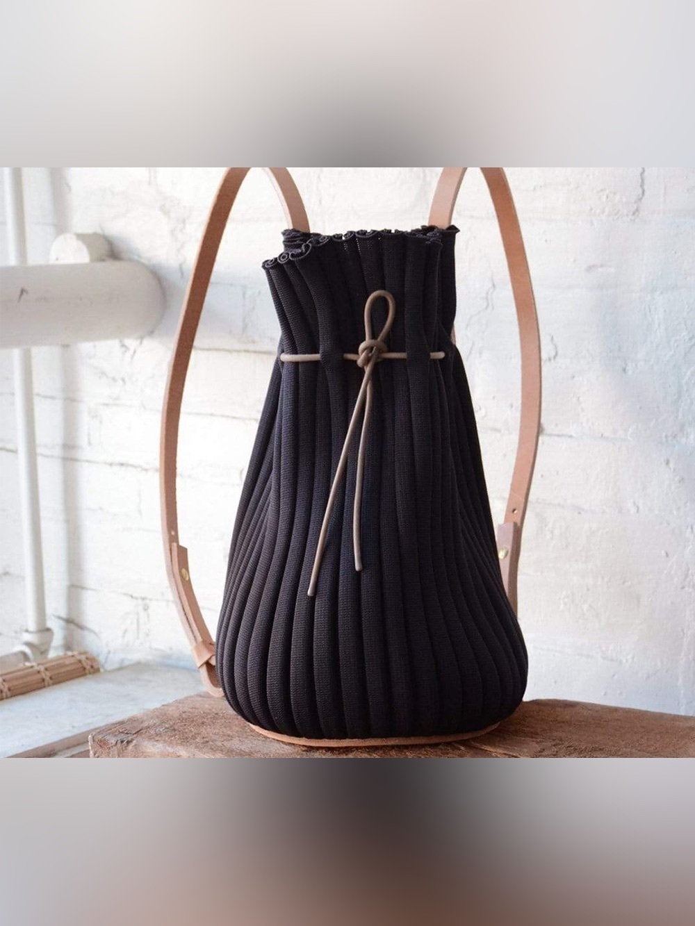 Hoi Bo Exhale Supernova Knit Pleated Backpack – Black and leather straps